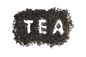 Dry black tea leaves. Isolated on white background. Inscription, word tea