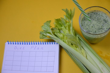 Healthy green smoothie and ingredients on yellow - superfoods, detox, diet, health, vegetarian...