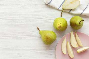 Top view fresh pears on white wooden table. From above, overhead. Copy space.