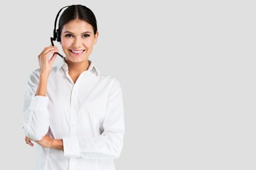 Young woman with headphones, call center