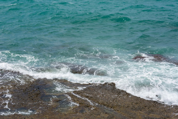 sea wave runs on a rocky shore