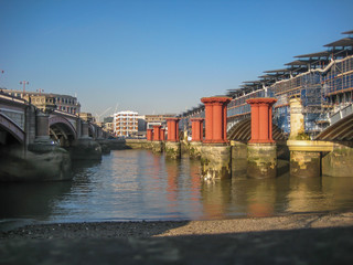 Fototapeta na wymiar View of the banks of the River Thames, in London, UK