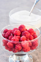 Glass of fresh raspberries and white sugar gardening gastronomy harvest