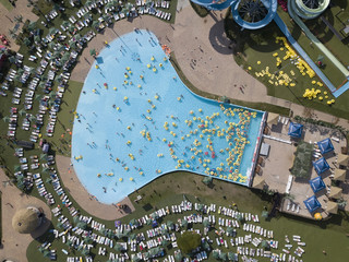 People have a relax in the water park outdoors. Photo from the air