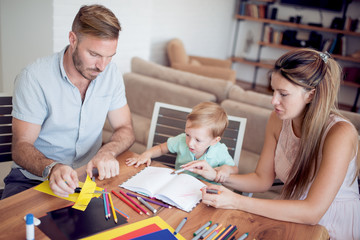 Parents draw with a little son