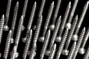 screws on a black background