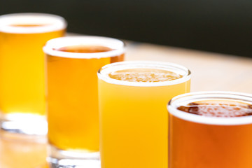 Close up on a flight of craft beer in a diagonal row