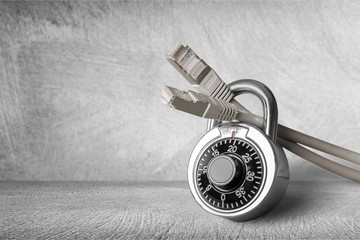 Lock and network cable on background