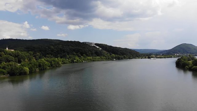 Aerial view of the Danube River and Walhalla memorial on the hill, ship with tourists sailing along the river, Donaustauf, Bavaria, Germany