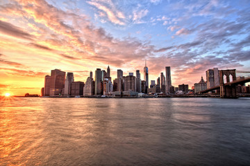 Fototapeta na wymiar New York City Lower Manhattan with Brooklyn Bridge at Sunset