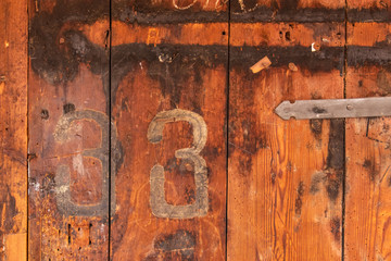 Old wood pattern background with number 33 painted on it
