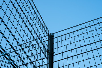 metal fence on blue sky -  metal grid construction