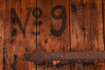 Old wood pattern background with number 9 painted on it