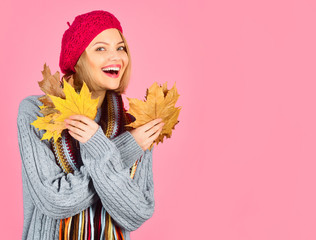 Autumn portrait of blonde hair woman with maple leaf. Autumn. Autumn mood. Sensual woman with autumnal leaf. Yellow maple leaf. Smiling woman holds leaf in hand. Copy space.