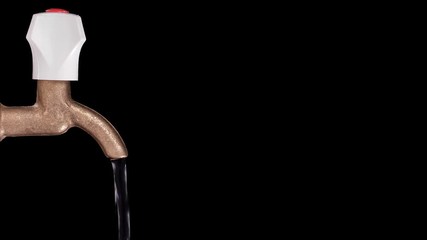 water flows from the tap on a black background