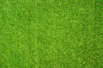 Beautiful Green artificial grass background vignette or the naturally walls texture Ideal for use in the design fairly. natural pattern texture fresh spring from golf course or  soccer field.