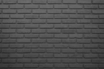 Obraz premium Black and grey brick wall texture background. Brickwork or stonework flooring interior rock old pattern clean concrete grid uneven bricks design stack.