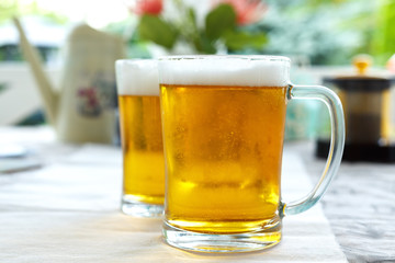 Two glasses of beer are on the table