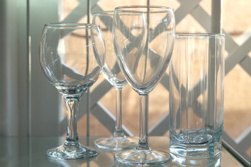 Empty glasses are on the glass shelf