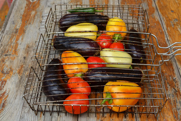 Fresh vegetables laid out on the grill for baking