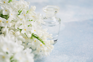 Fragrance on glass bottle for perfume with white lilac