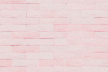 Pink and white brick wall texture background. Brickwork or stonework flooring interior rock old...