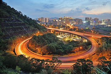 Fototapeta na wymiar City interchange overpass at nightfall in Xindian, Taiwan