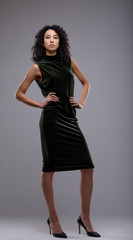 Fototapeta premium Stylish serious woman in an elegant black dress