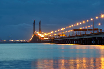 The bridge against the background of dramatic sky at dawn