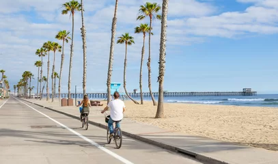 People riding Bikes at beach © dcorneli