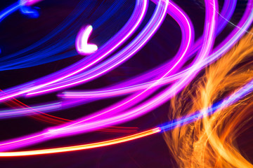 Abstract background with color lines. Bright abstract pattern in a color different lines on a black