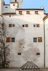 Medieval era fortress Salzburg main building with archaic canon balls