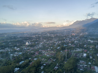 Fototapeta premium Aerial view of sunset in the town of Ruteng in Indonesia.
