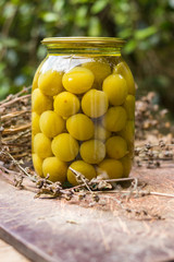 Canned tkemali sour plums in glass jar. Georgian traditional food or cuisine. Healthy vegan or vegetarian food.