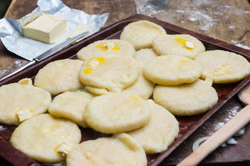 Cooked khachapuri bread with suluguni cheese and butter. Georgian traditional food.