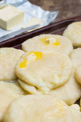 Cooked khachapuri bread with suluguni cheese and butter. Georgian traditional food.