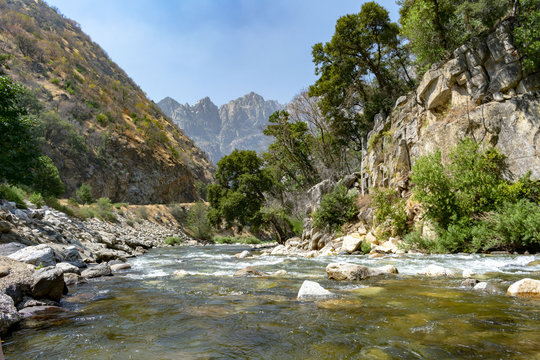 A landscape view of the mountain river in Kings Canyon national Park in California with rigged mountain as background