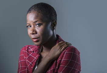 lifestyle isolated portrait of young attractive and sad black african American woman feeling unwell...