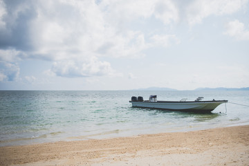 Fototapeta na wymiar Boat Parked By The Beach