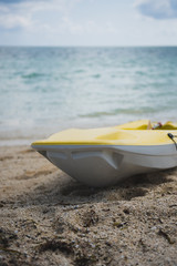 Obraz premium Yellow Kayak Placed On The Beach