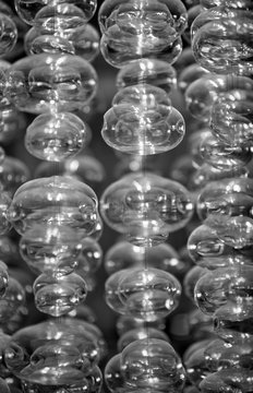 glass orbs that look like bubbles suspended in the air