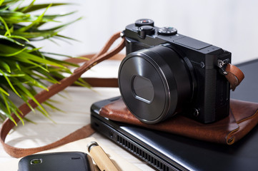 mirrorless camera with leather strap