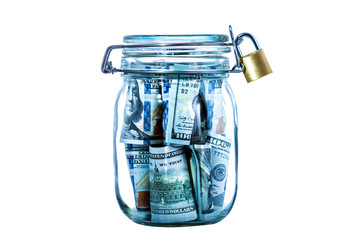 Many 100 US dollars bank notes in a glass jar with lock isolated  on white background.Safety storage of money.