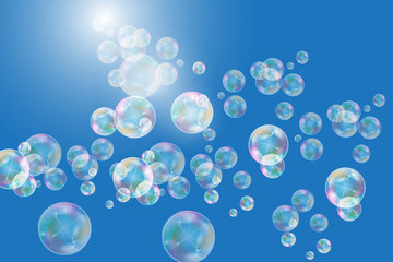 Realistic soap bubbles with rainbow reflection set isolated on the blue background.