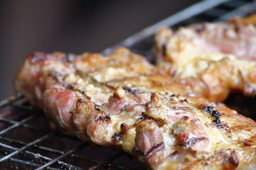 delicious food pork grilling on hot charcoal