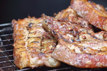 delicious food pork grilling on hot charcoal