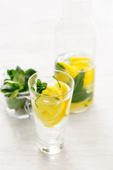 Fresh lemon cucumber mint detox drink glass white wooden table Detox water fitness healthy nutrition diet concept