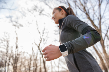 Runner wearing fitness smart watch running