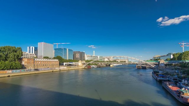 The Austerlitz viaduct in Paris timelapse hyperlapse, seen from bank of the river Seine with a metro train passing