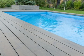 Special wooden board around the swimming pool, texture, background.